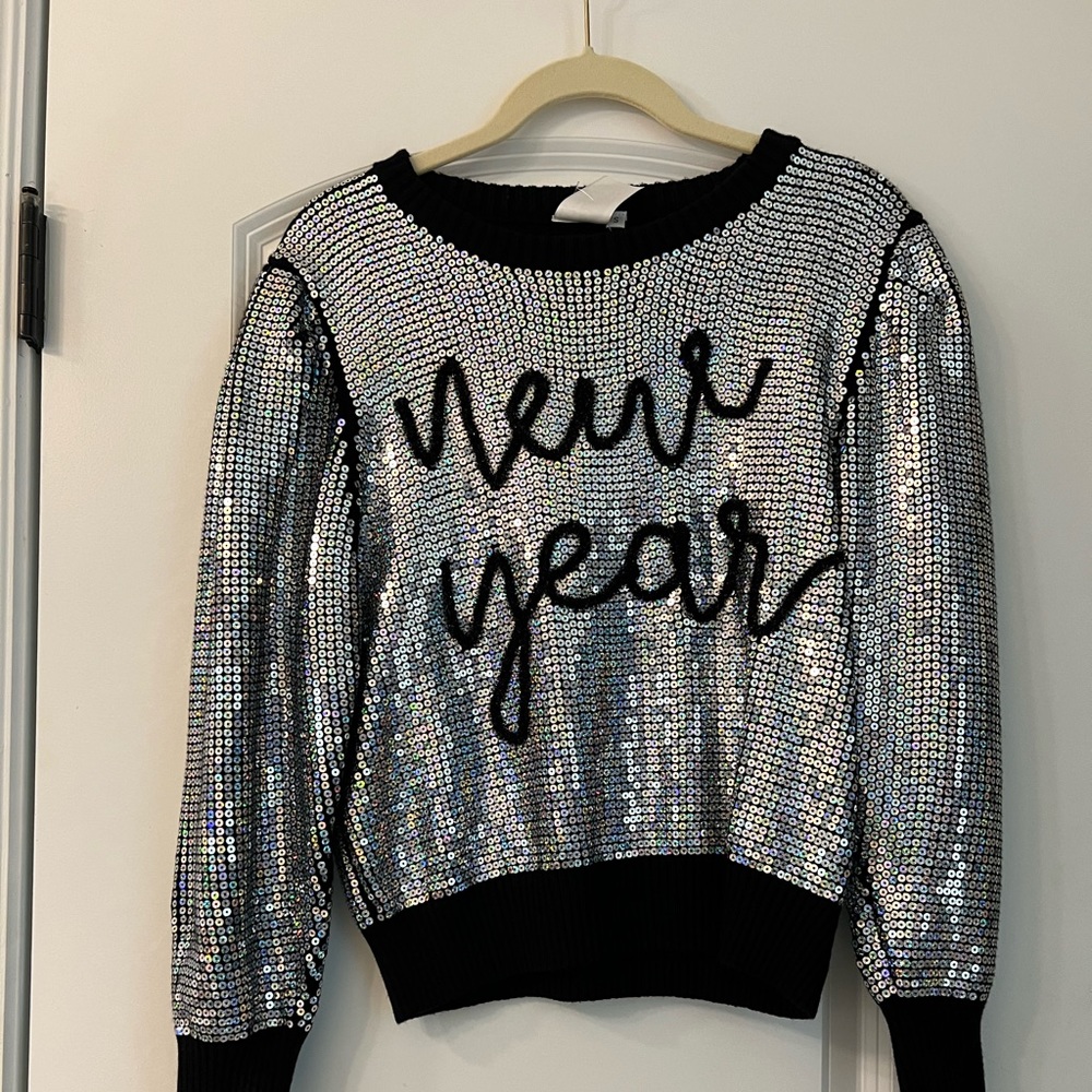 Brand new never work sparkle city sweater. Size small.